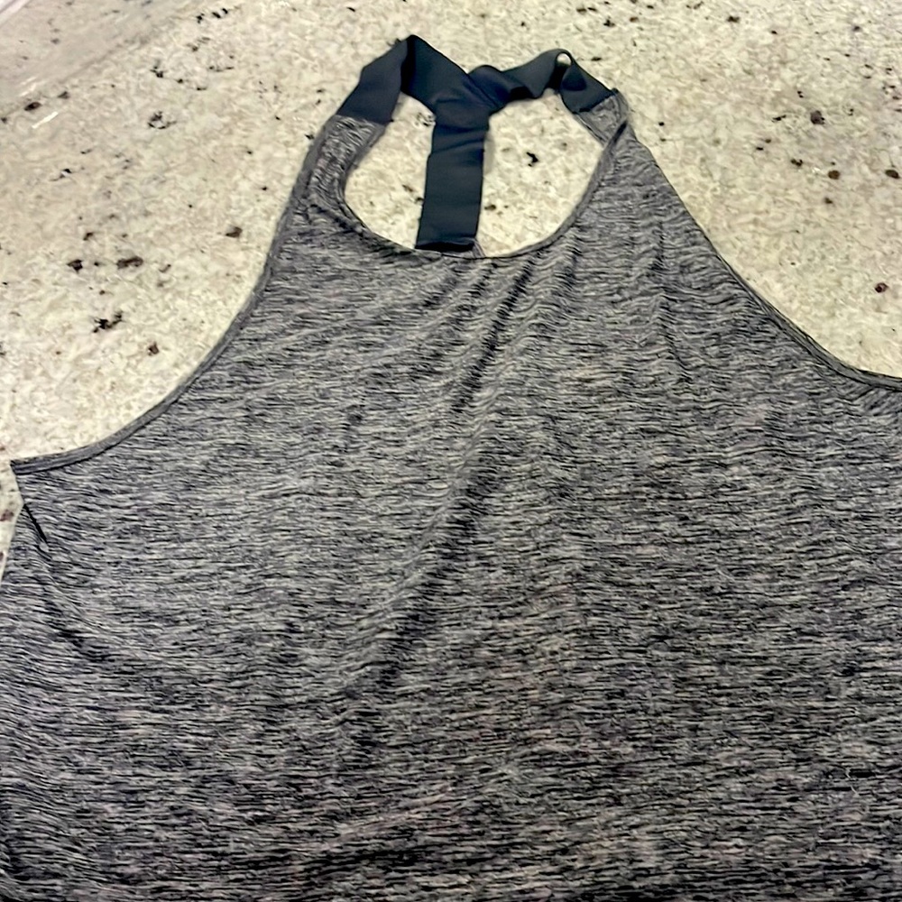 Under armour workout tank, size extra large. Gray with strappy back detail